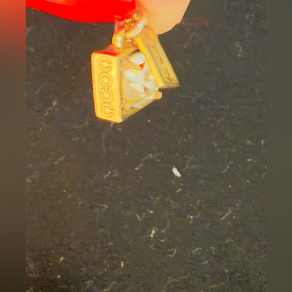 Coach gold tone necklace. Dangly gem with gold around with coach tag. - Picture 4 of 6